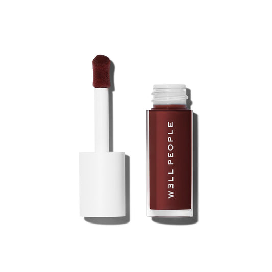 Well People front packaging showing Dewy Iris shade and glossy finish benefit