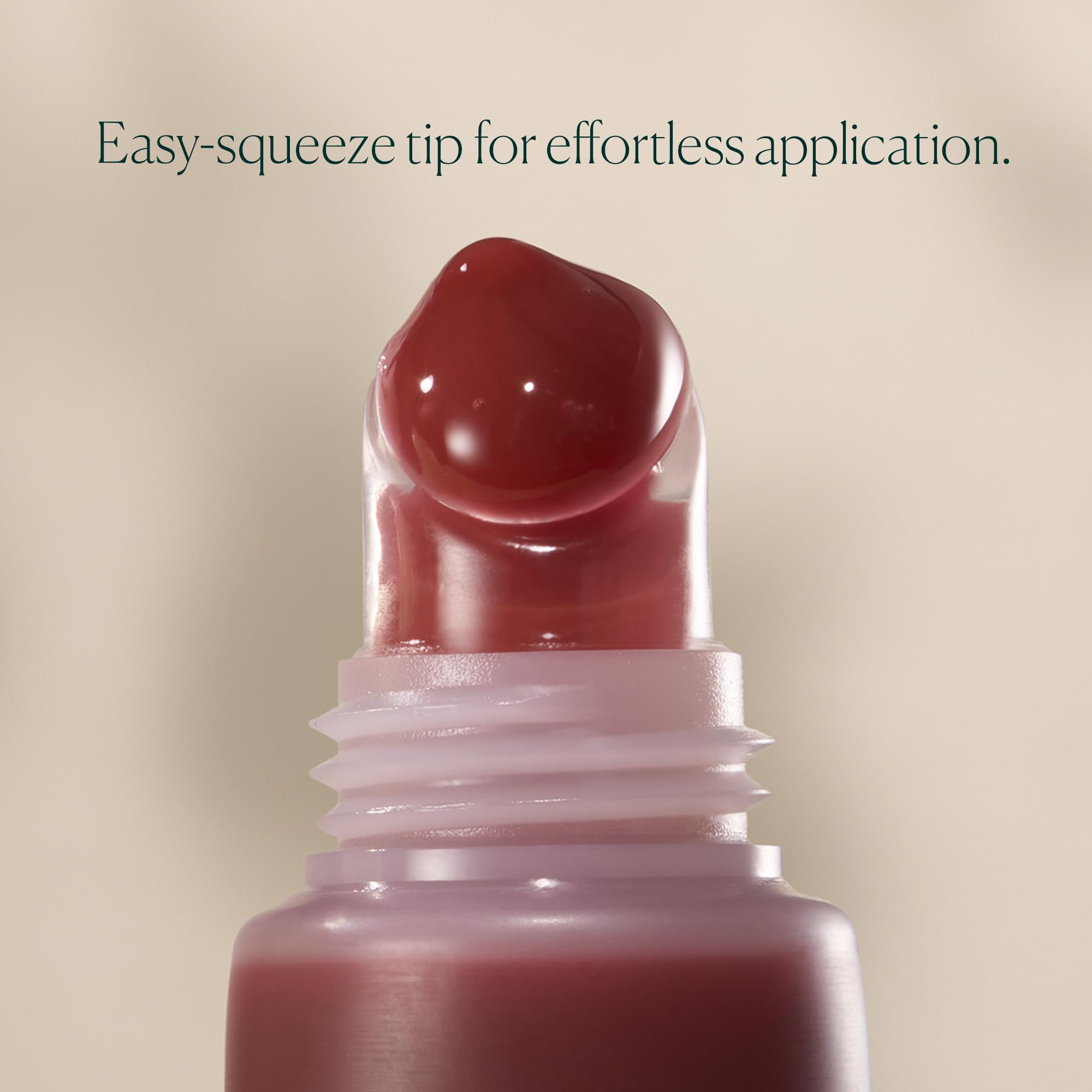 Well People on lips lifestyle shot, showing sheer pink grapefruit color and plumper look