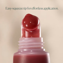 Well People on lips lifestyle shot, showing sheer pink grapefruit color and plumper look