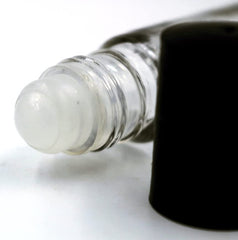 Well's Oil glass bottle texture highlighting quality materials and scent preservation