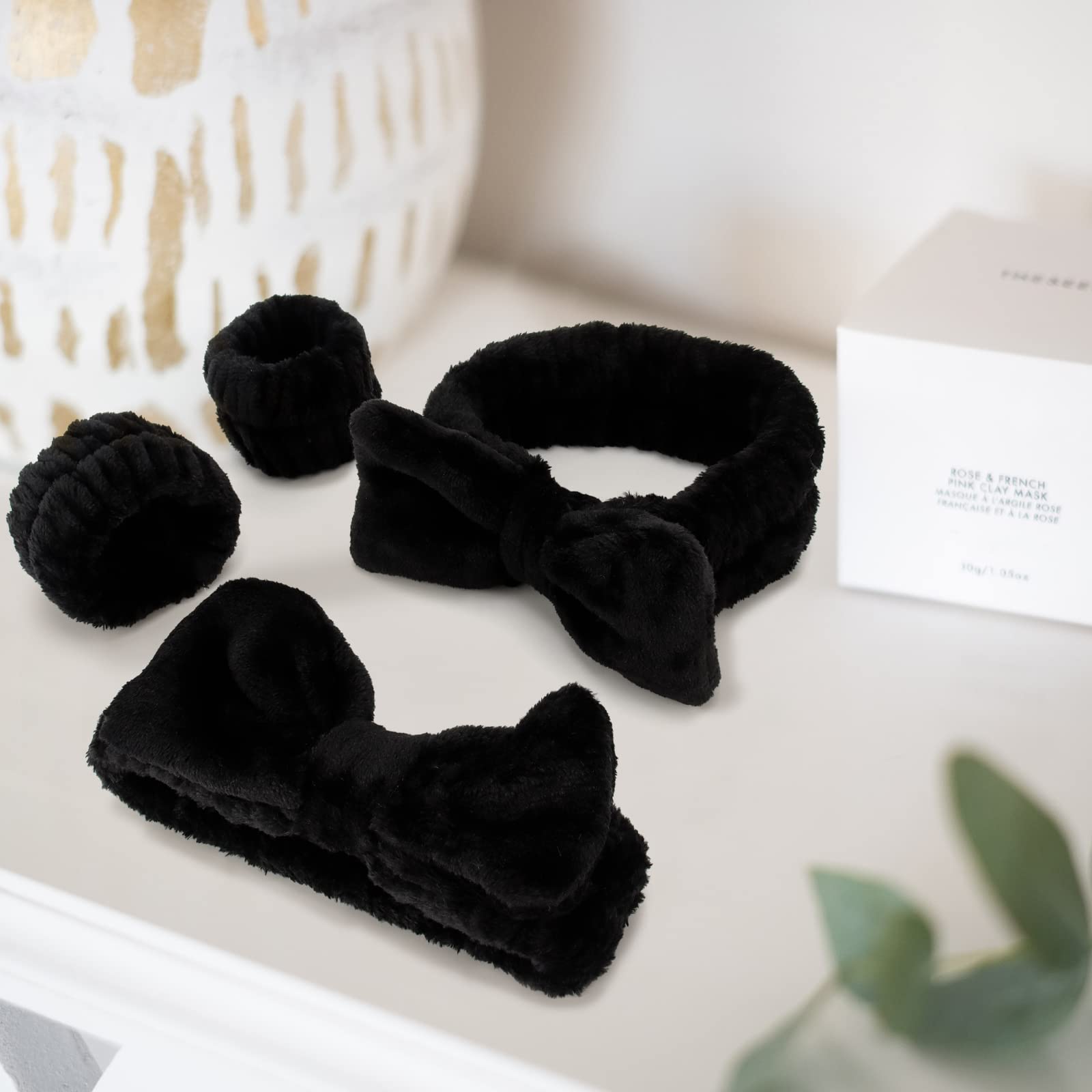 WHAVEL stacked folded headband and wristbands showing easy storage and portability