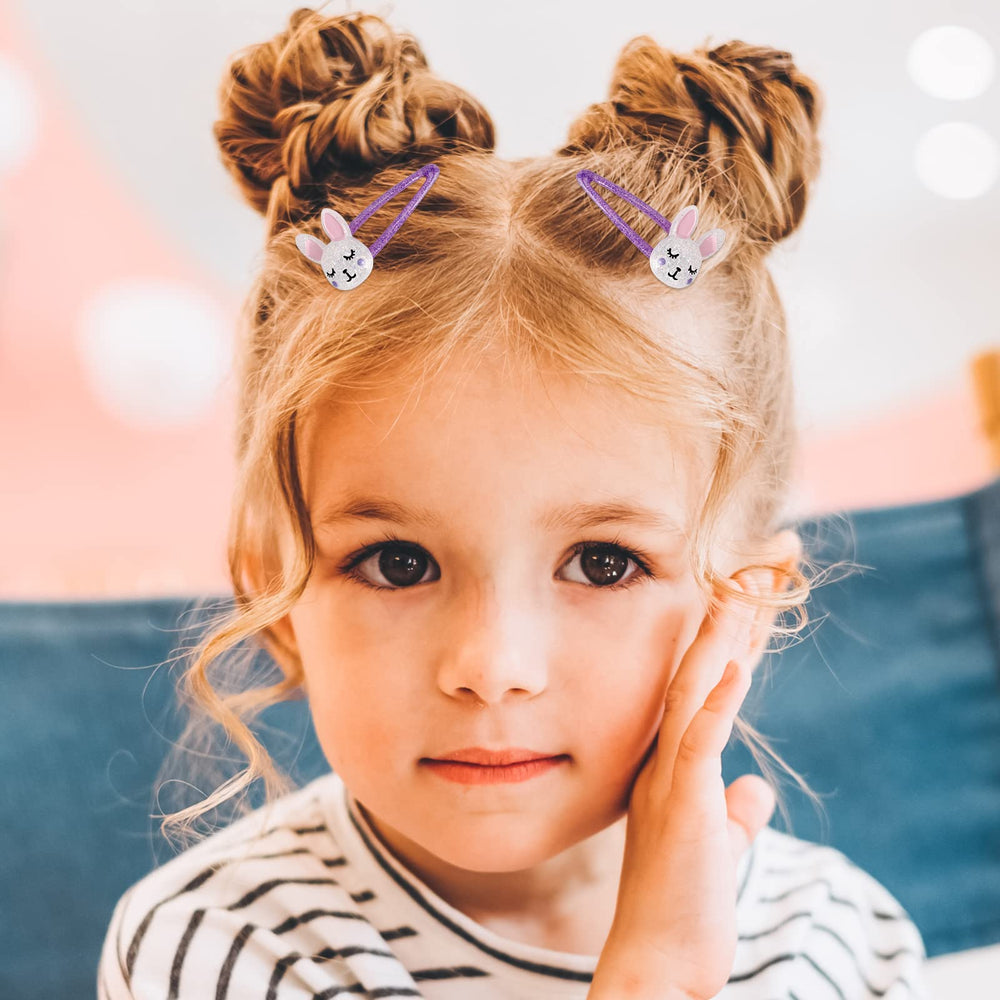 Wingchold clip fastened in child's hair showing secure hold and charm