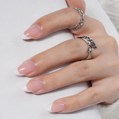 WiniBeauty hands applying a press-on nail showing quick, mess-free application benefit