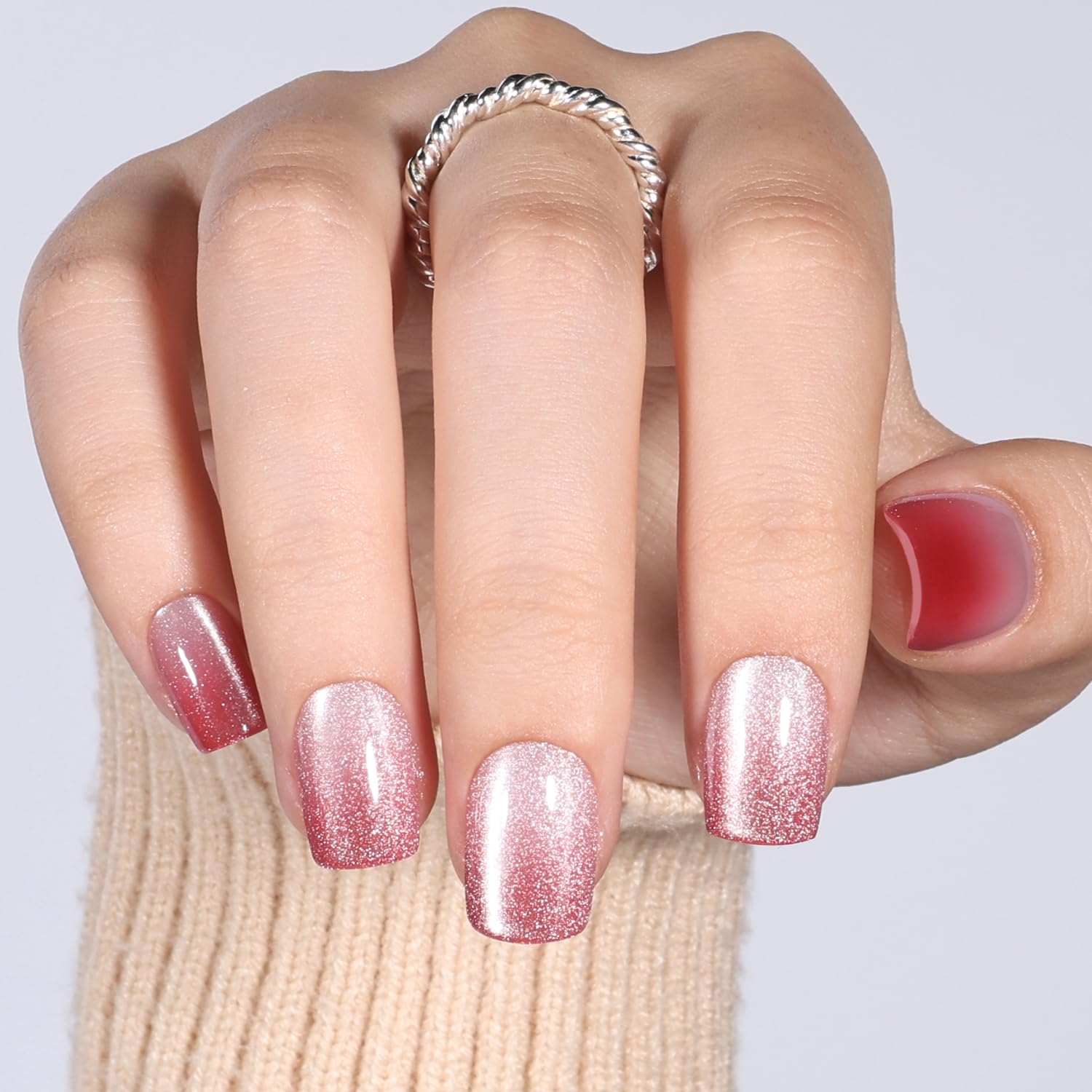 WiniBeauty nails beside a quarter for scale to help size choice and fit
