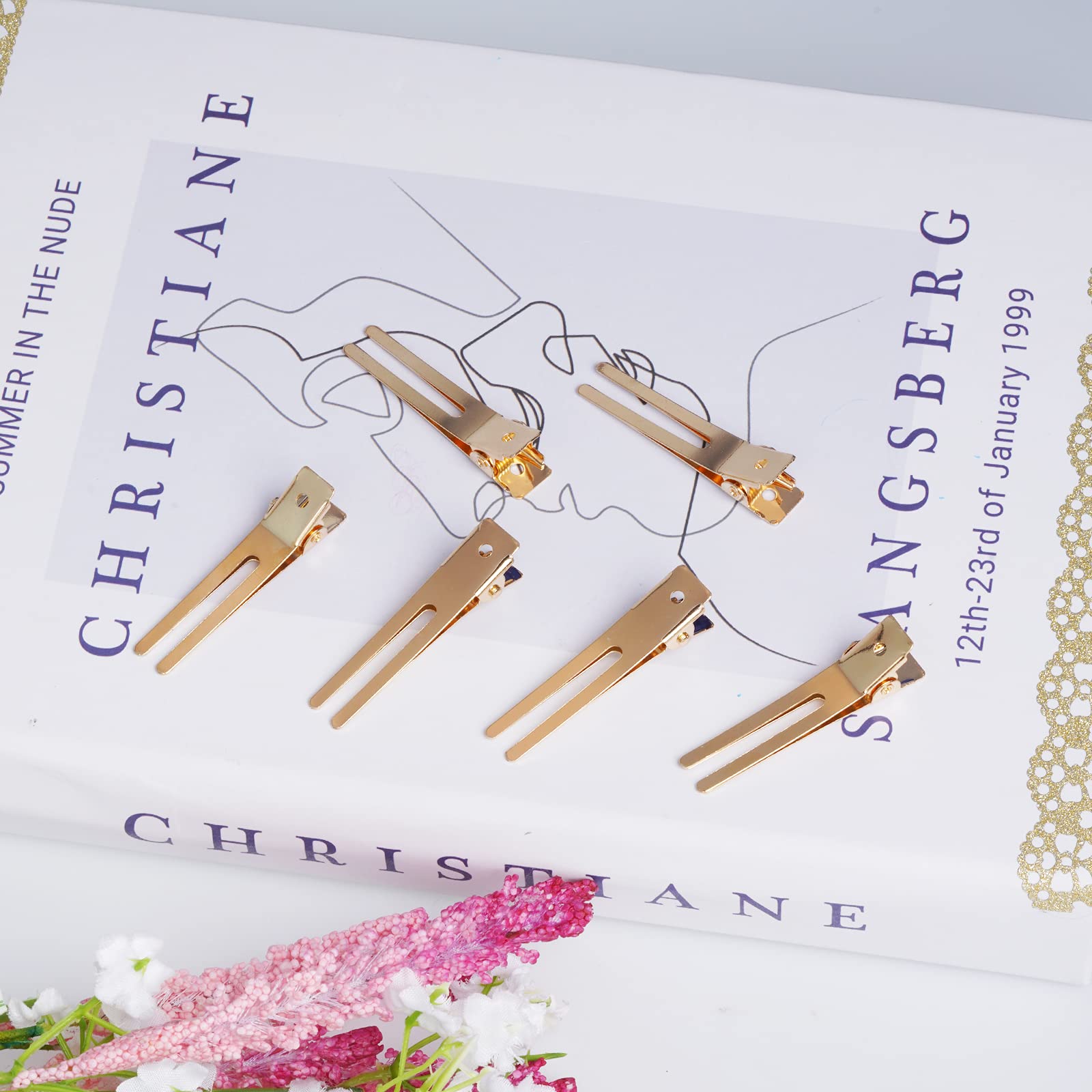 Wobe clips clamped over hair roller to maintain curl shape while drying