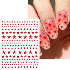 Woduntes manicure in use with stickers against fireworks backdrop, festive look