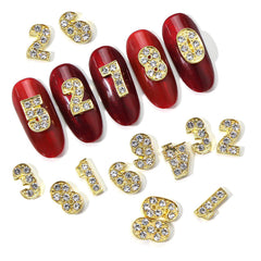 WOKOTO close-up of rhinestone detail on a gold number charm highlighting sparkle