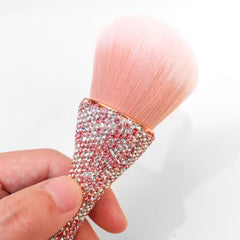 WOKOTO brush in use sweeping acrylic dust off a manicured nail for neat results