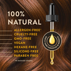 WoldoHealth applying argan oil to hair ends for frizz control and shine