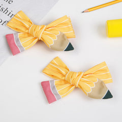WOVOWOVO pencil clip worn in ponytail demonstrating secure hold