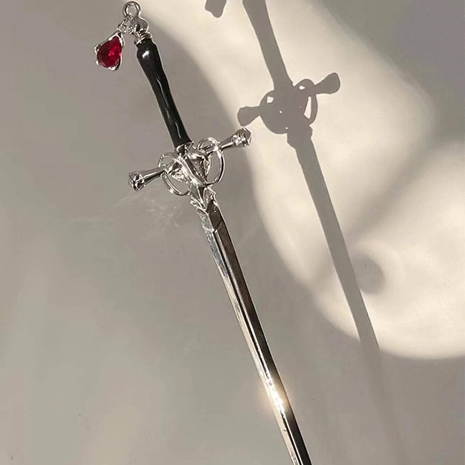 WOVOWOVO sword hair sticks close detail highlighting metal texture and craftsmanship