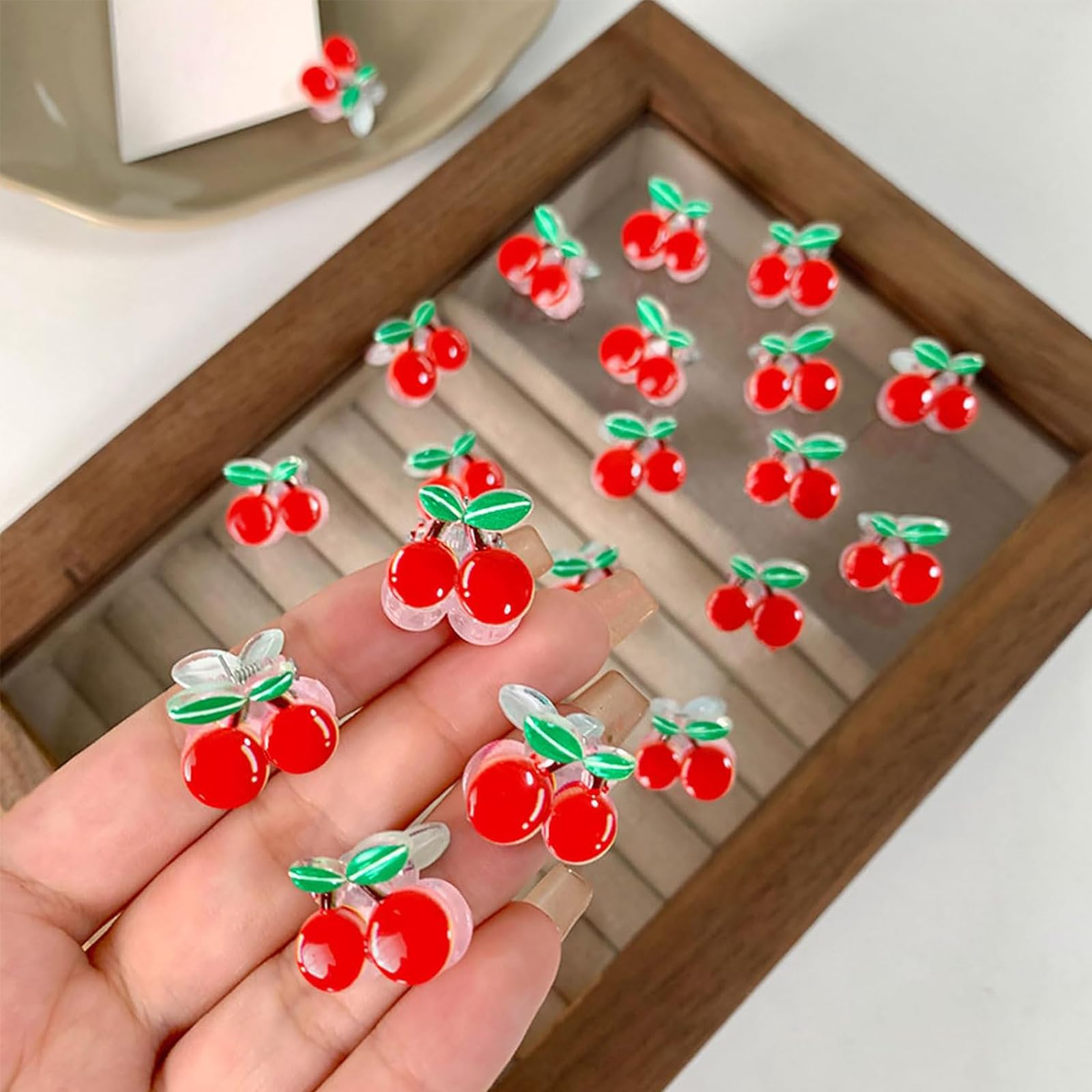 WRBAJIS cherry clips in hand showing true size and portability