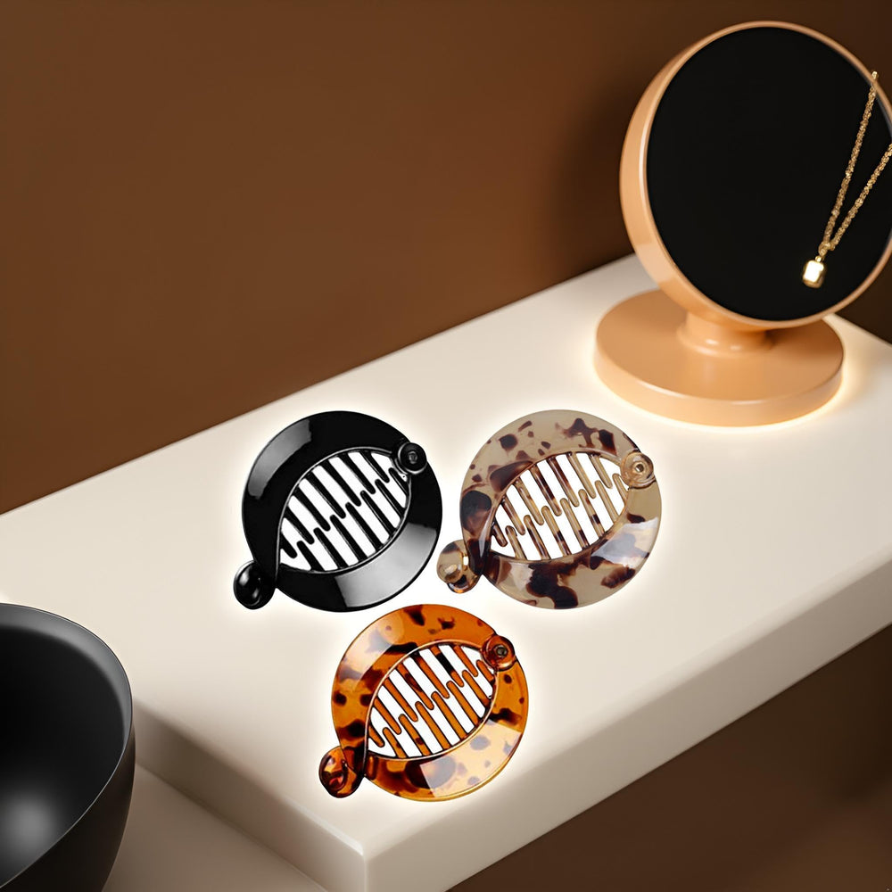 WsjiaboFux clips on a tabletop beside a bag indicating travel-friendly convenience