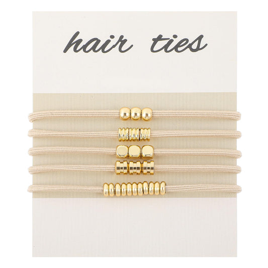 WY LIGHTING LEVEL front view of five gold-beaded hair ties showing elegant styling benefit
