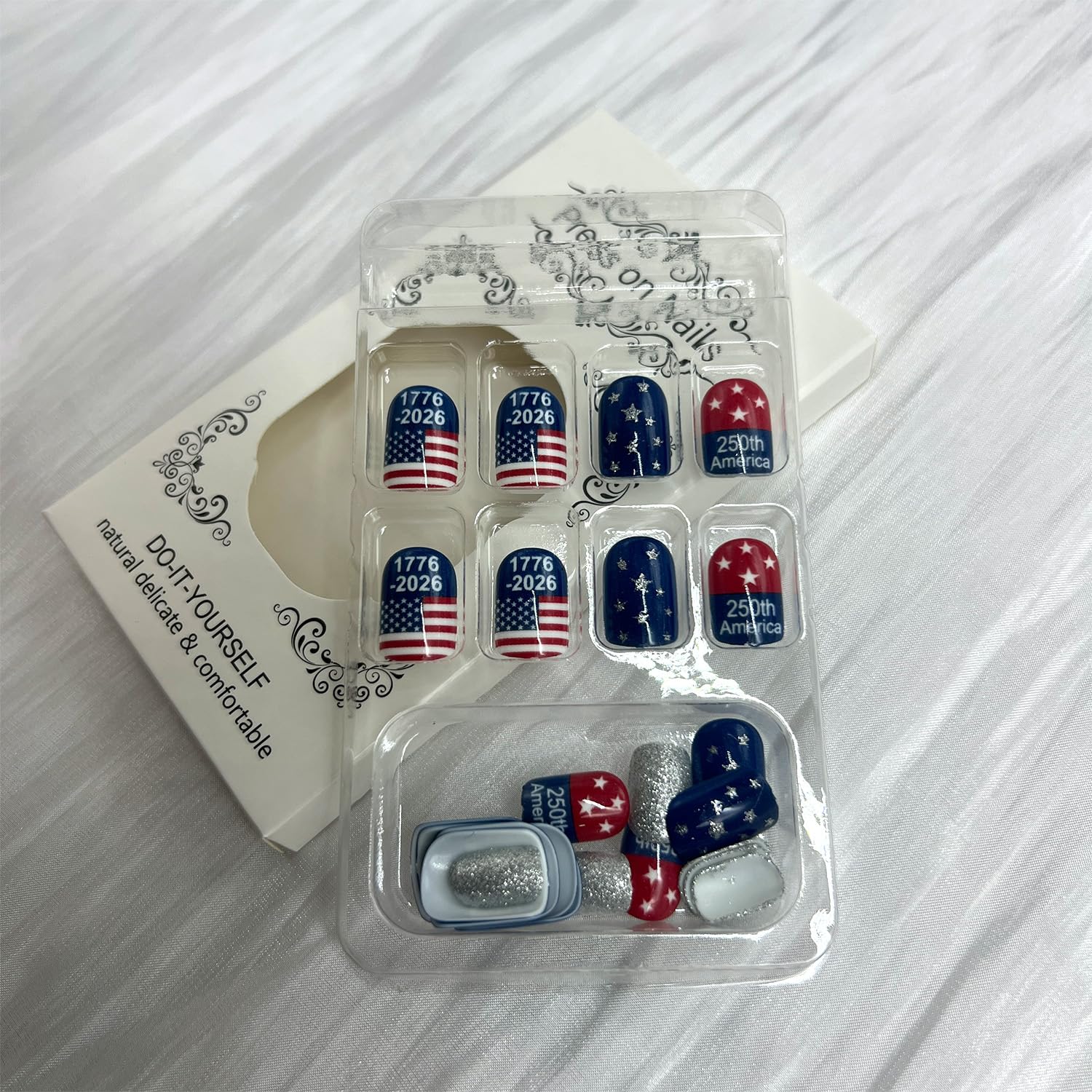 WYFHDT hands applying press-on nails quickly for fast event-ready patriotic manicure