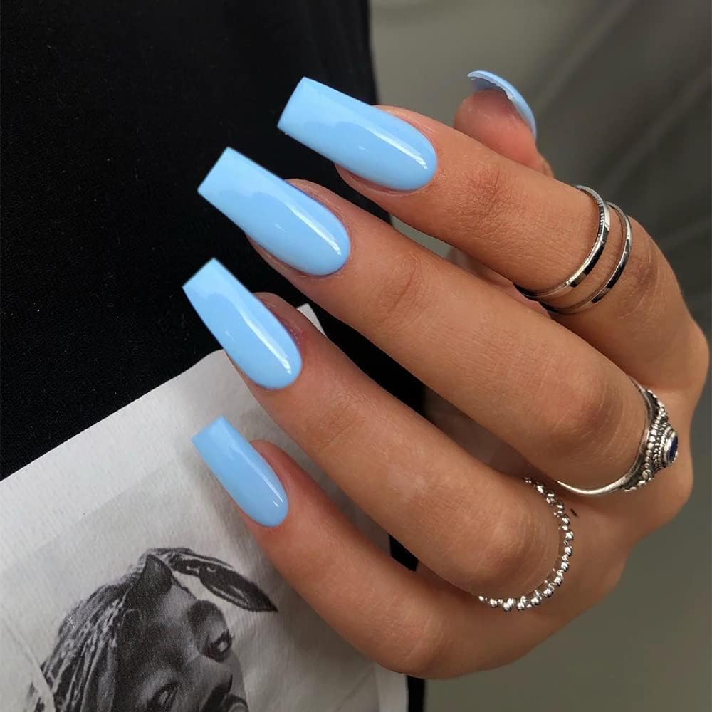 XCREANDO front packaging showing baby blue press-on nails and clear tray benefit of organized storage