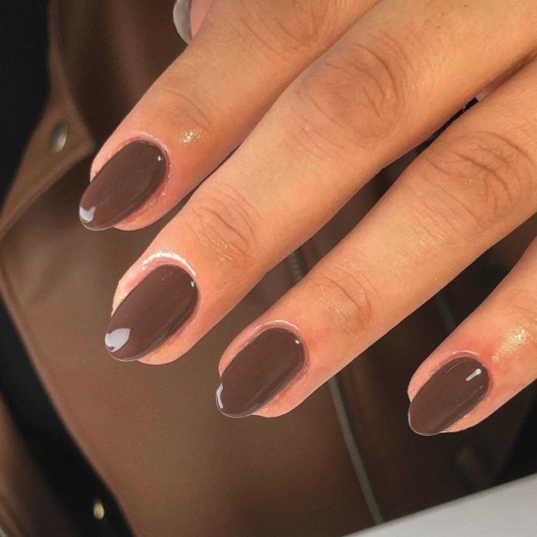 XCREANDO front packaging showing 24 brown press-on nails and benefits