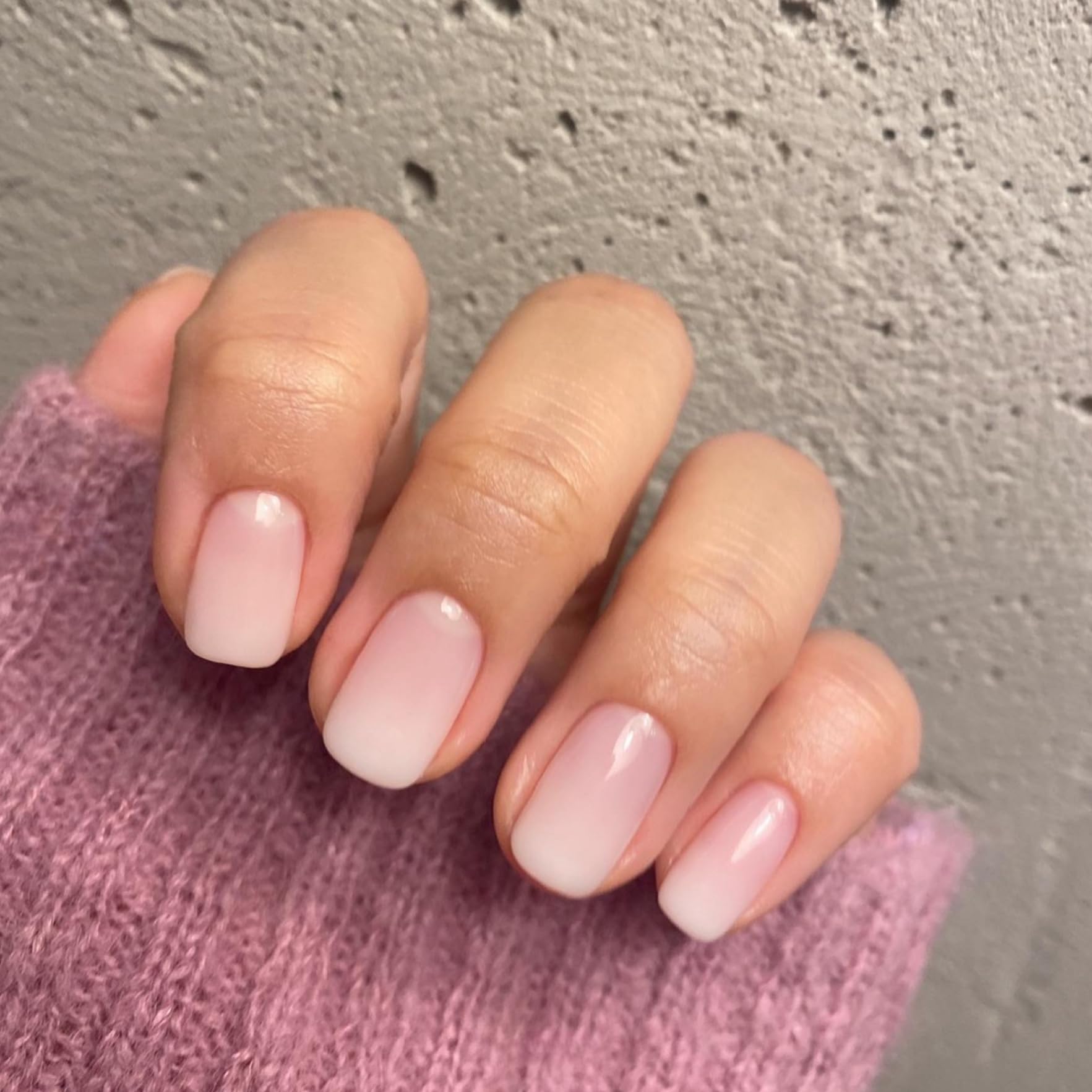 XCREANDO nails held in hand to show scale and easy short-square everyday wear