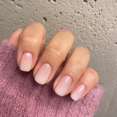 XCREANDO nails held in hand to show scale and easy short-square everyday wear