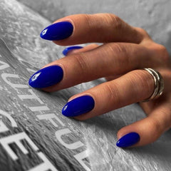 XCREANDO packaging showing 24-piece royal blue short almond nails for easy selection