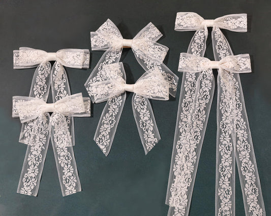 XFYUZR front view showing white lace bow and tails, elegant finishing touch