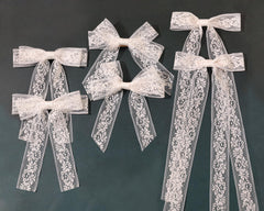 XFYUZR front view showing white lace bow and tails, elegant finishing touch