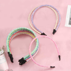 XIMA headband worn in hair demonstrating comfortable hold and subtle sparkle