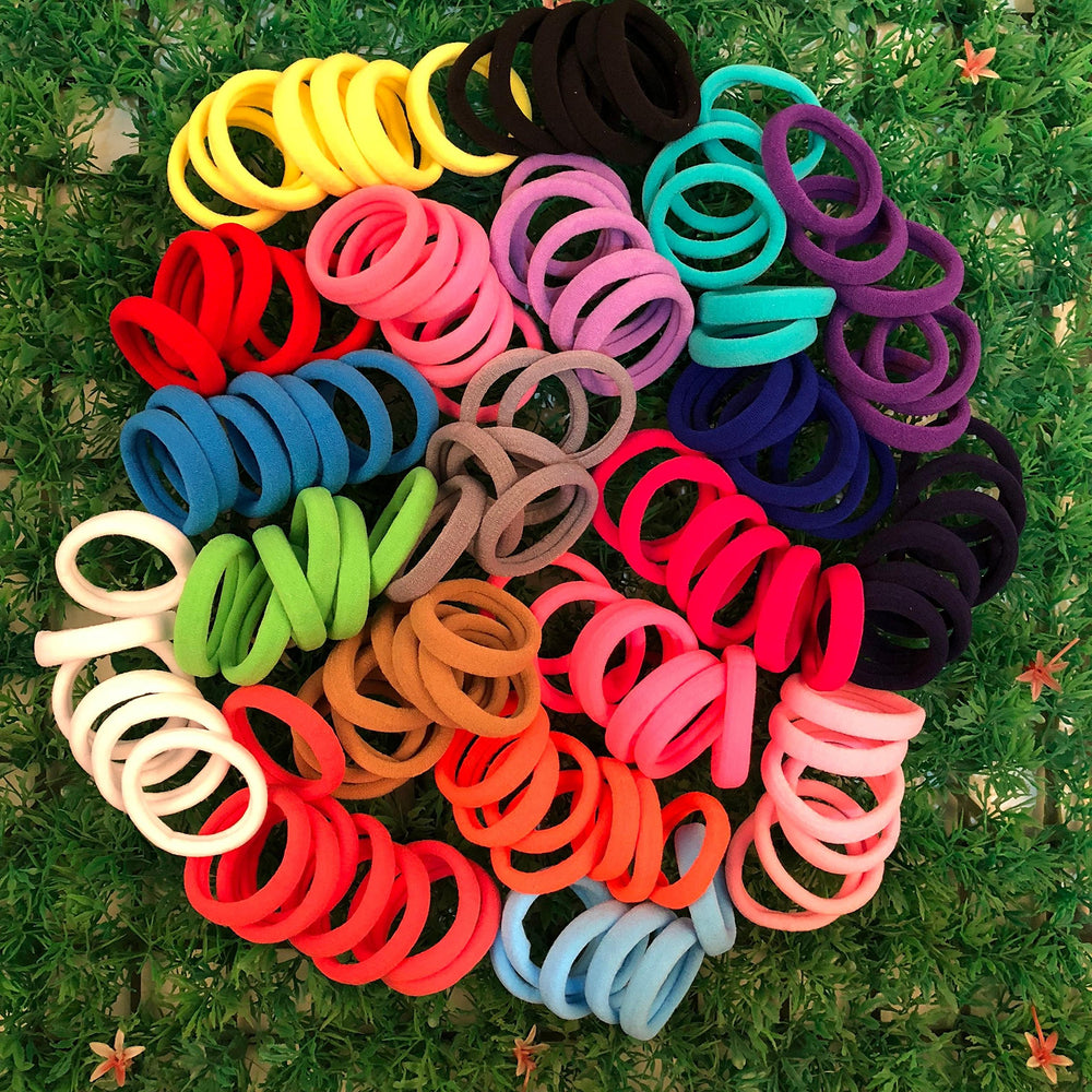XIMA hair tie beside ruler showing 1.5-inch diameter for sizing