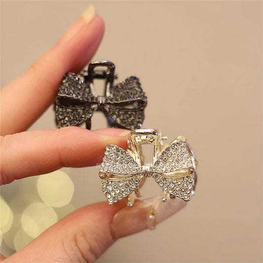 Xiwstar close-up of crystal rhinestone bow detailing for elegant shine