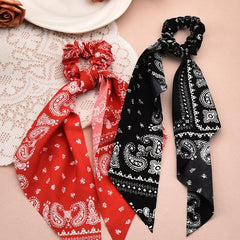 Xiyantiji scrunchie held in hand to show scale and flexible elasticity benefit