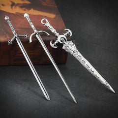 XJYHDY hand holding a sword hair pin to show size and scale