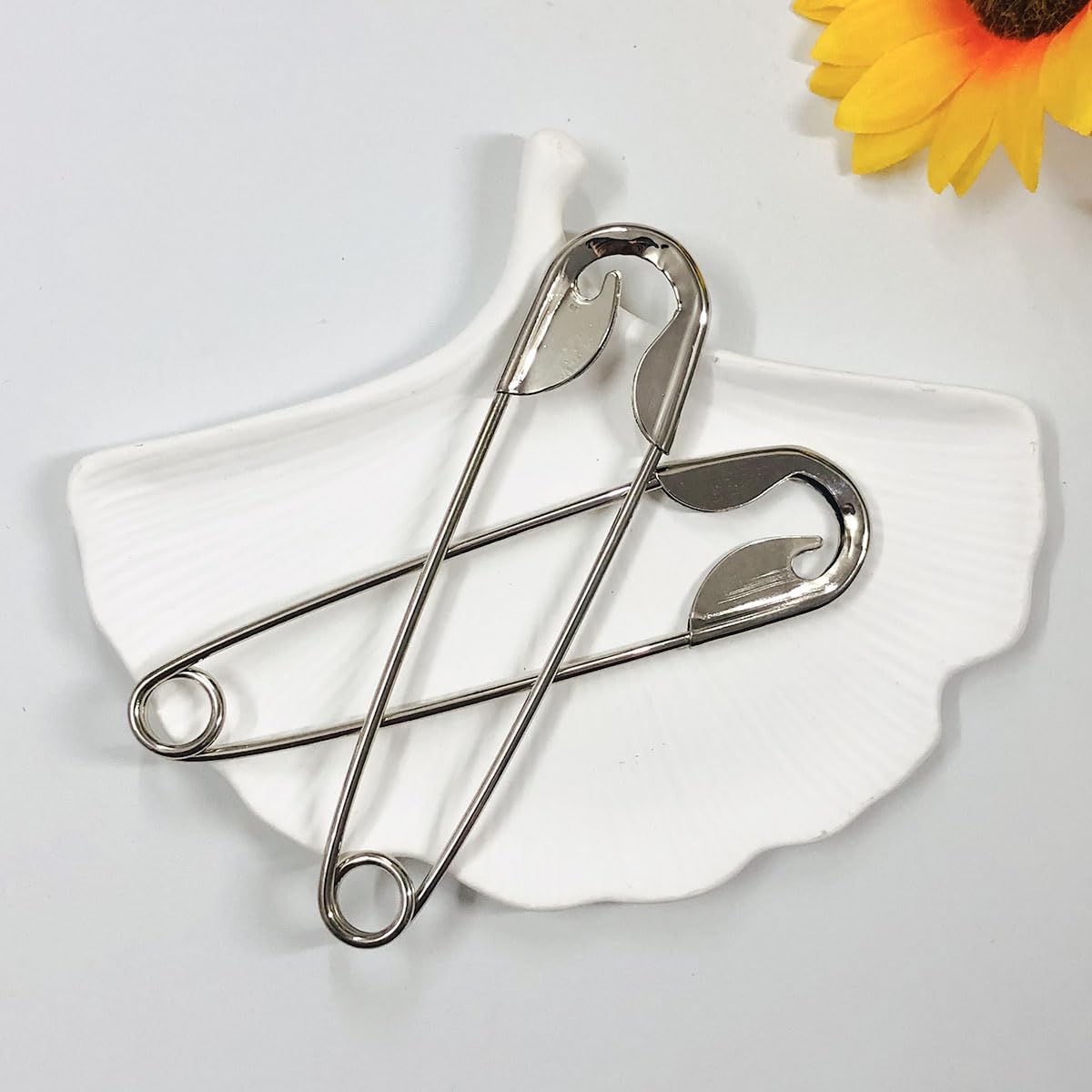 XnxnzhHo pins styled on a dressing table showing wearable minimalist elegance