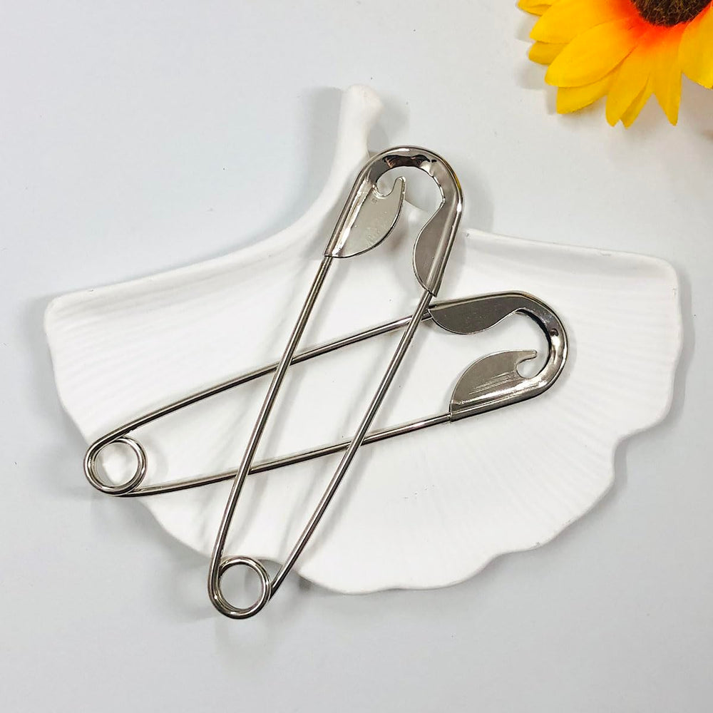 XnxnzhHo pins styled on a dressing table showing wearable minimalist elegance