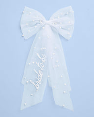 xo, Fetti bow laid out to show 17-inch tail length and scale