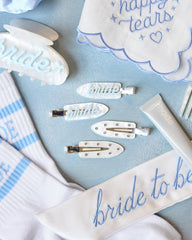 xo, Fetti close-up of blue bride text and rhinestones highlighting sparkle