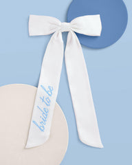 xo, Fetti close-up of blue "bride to be" embroidery for personalized detail