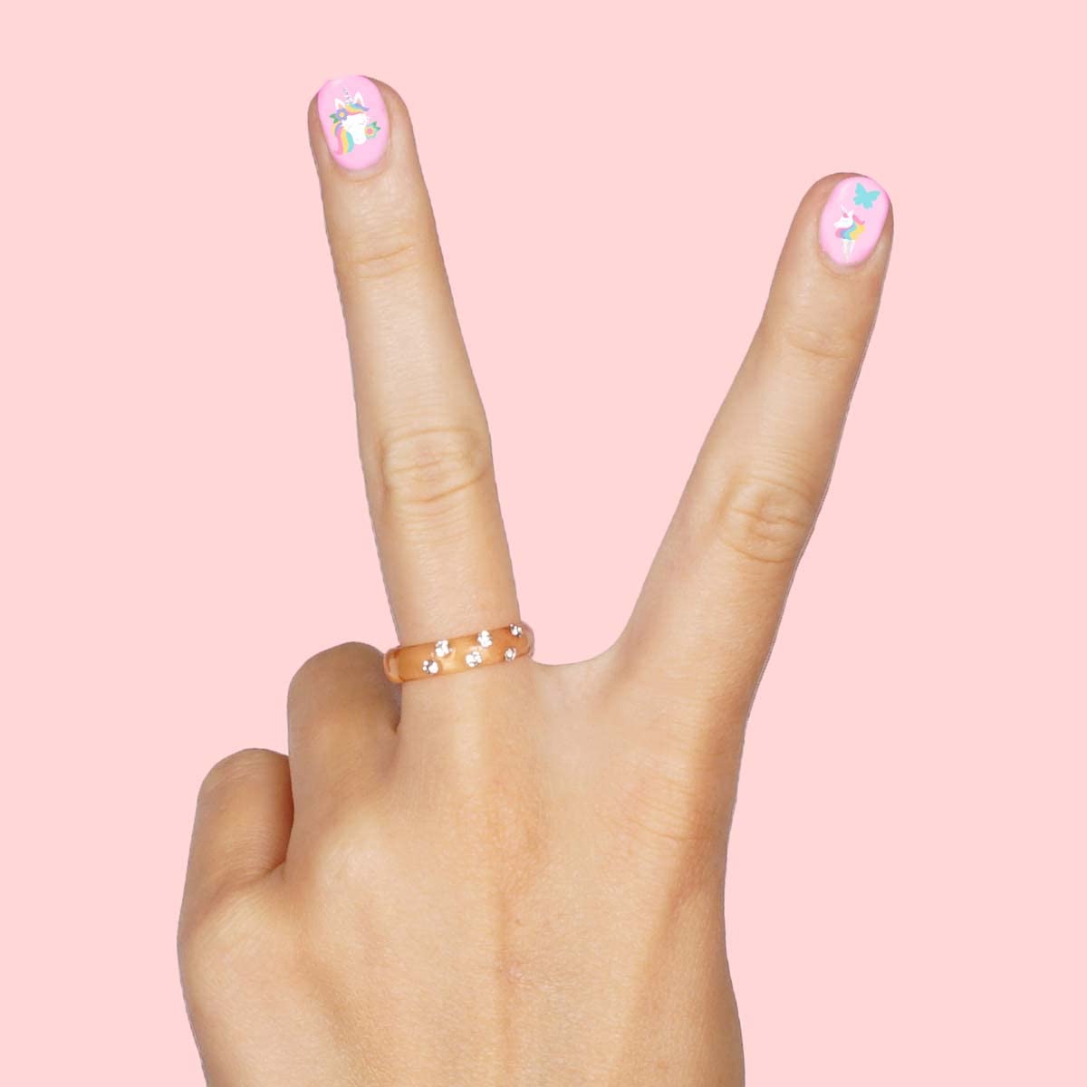 xo, Fetti party table with kids doing manicures showing fun group activity