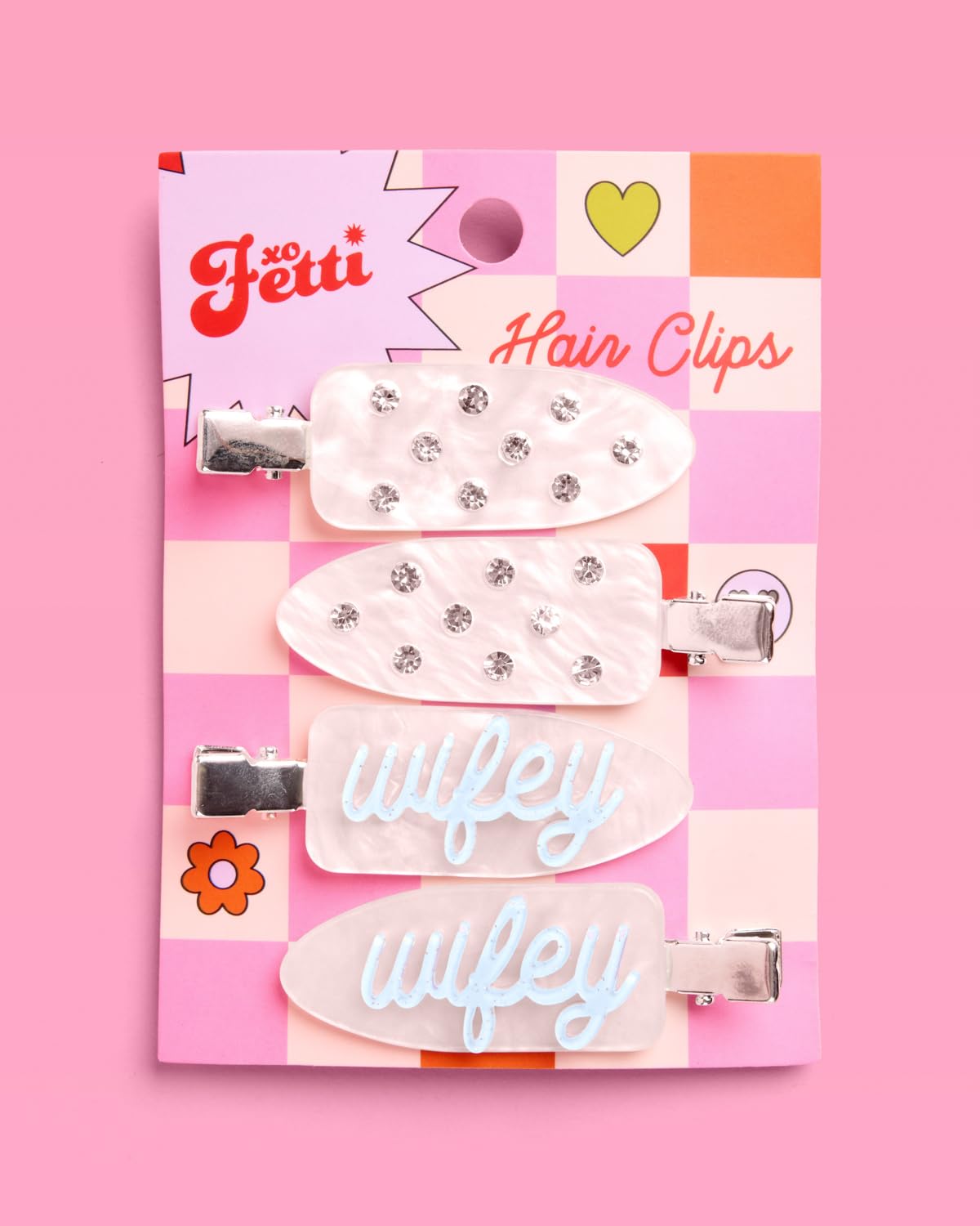 xo, Fetti clips on tabletop with bridal items showing celebration-ready styling
