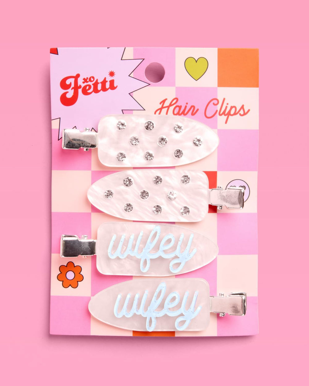 xo, Fetti clips on tabletop with bridal items showing celebration-ready styling