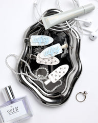xo, Fetti rhinestone clip close-up highlighting sparkle and elegant shine