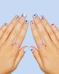 xo, Fetti beside ruler showing 3 by 4 inch sheet size for scale