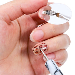 Xthrotsenk brush in use by manicurist demonstrating accurate cuticle cleanup