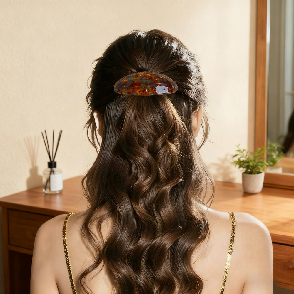 YCKXXL caramel barrette securing a low bun showing polished look and ease benefit