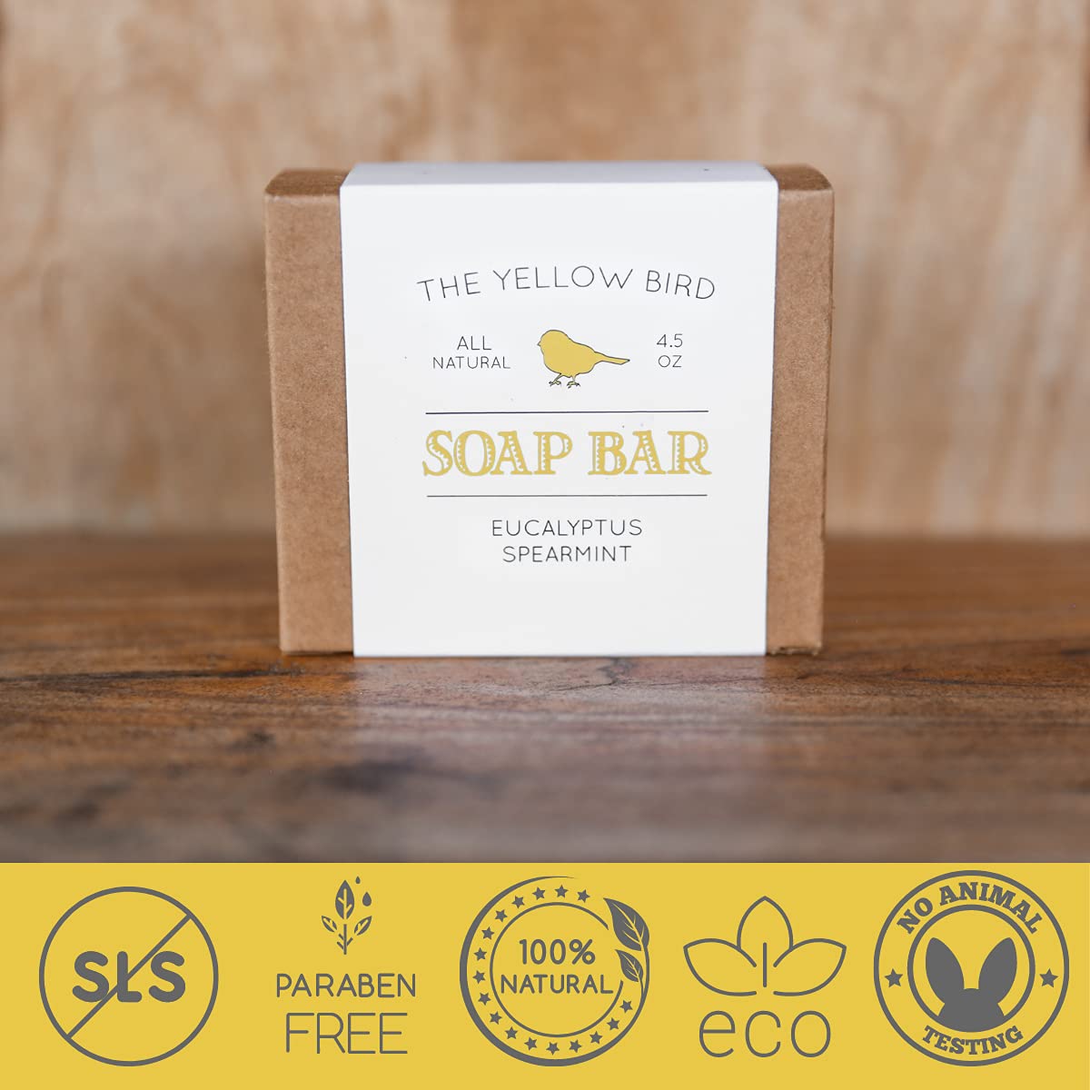 Yellow Bird bar beside towel and eucalyptus for a refreshing bathroom scene