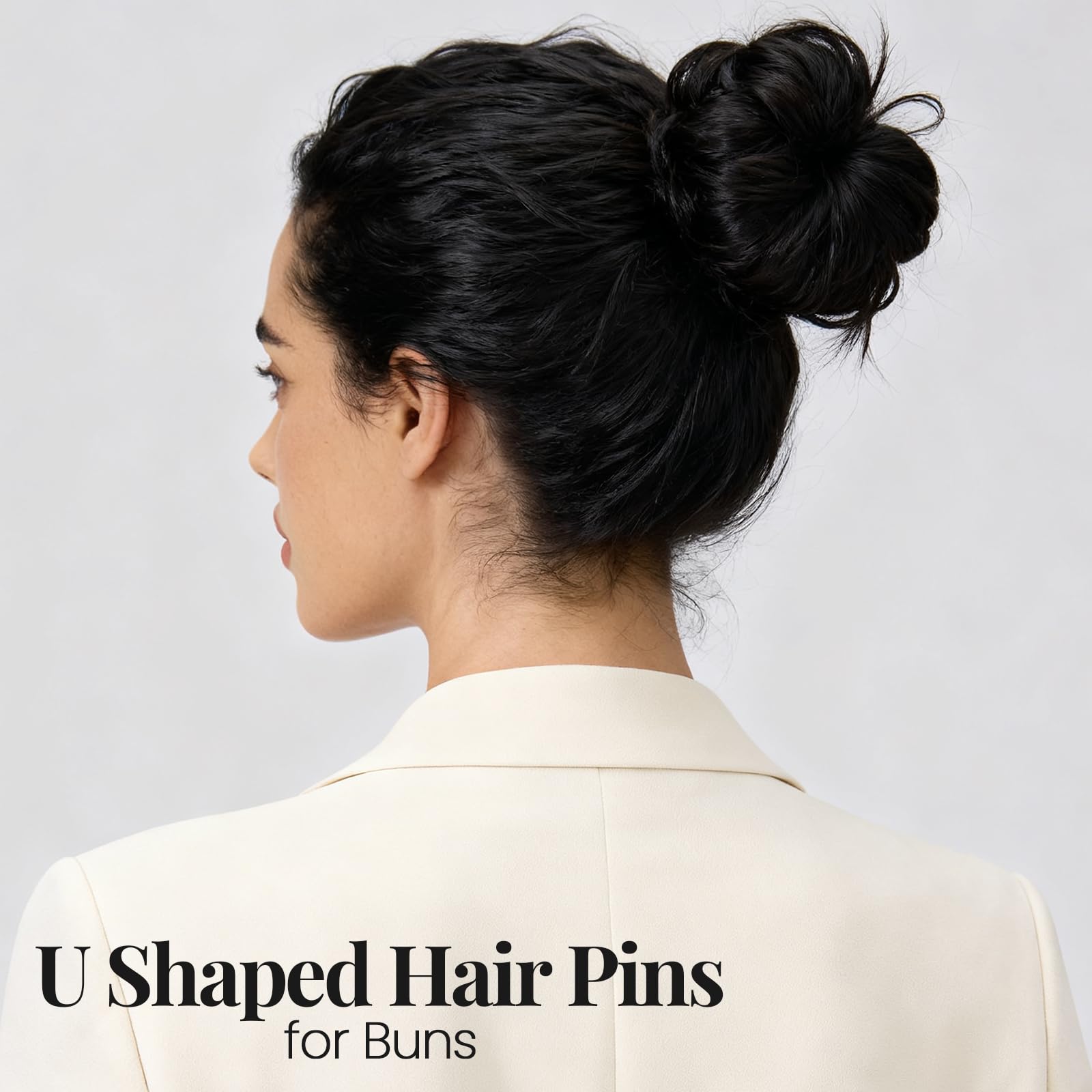 YGDZ pins next to a hand to show compact size and portability