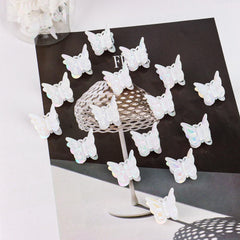 YISSION white butterfly clips scattered on tabletop showing quantity and finish