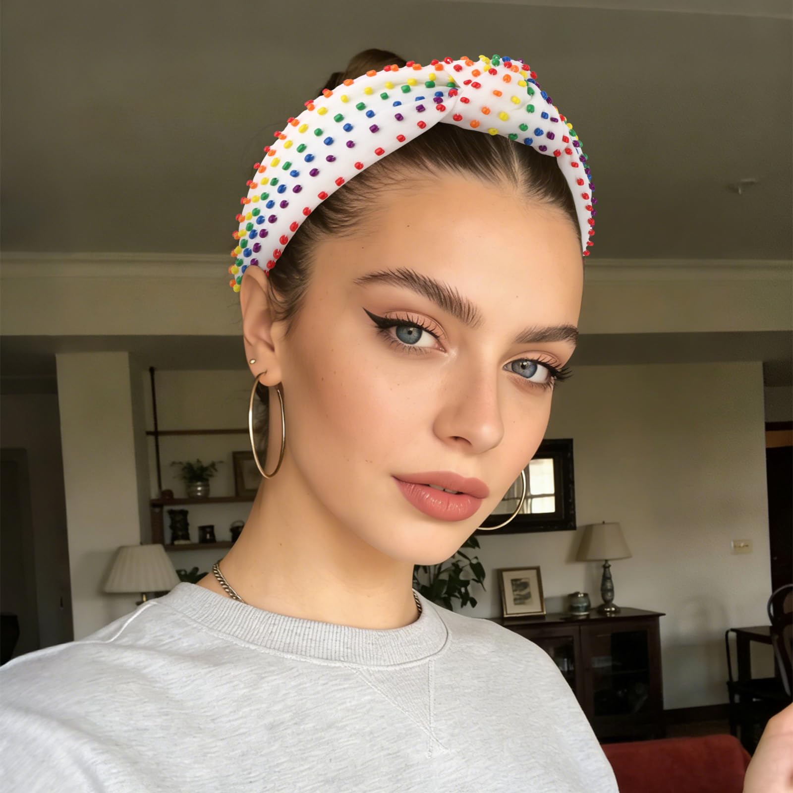 YISSION headband held in hand demonstrating adult size and scale