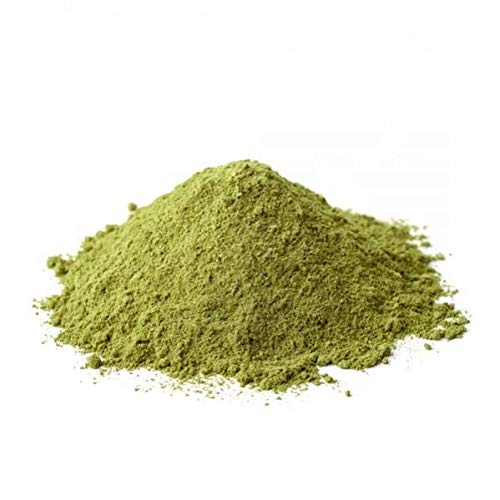 YOGI’S GIFT bhringraj paste applied to hair in a salon-style mask demonstrating nourishment
