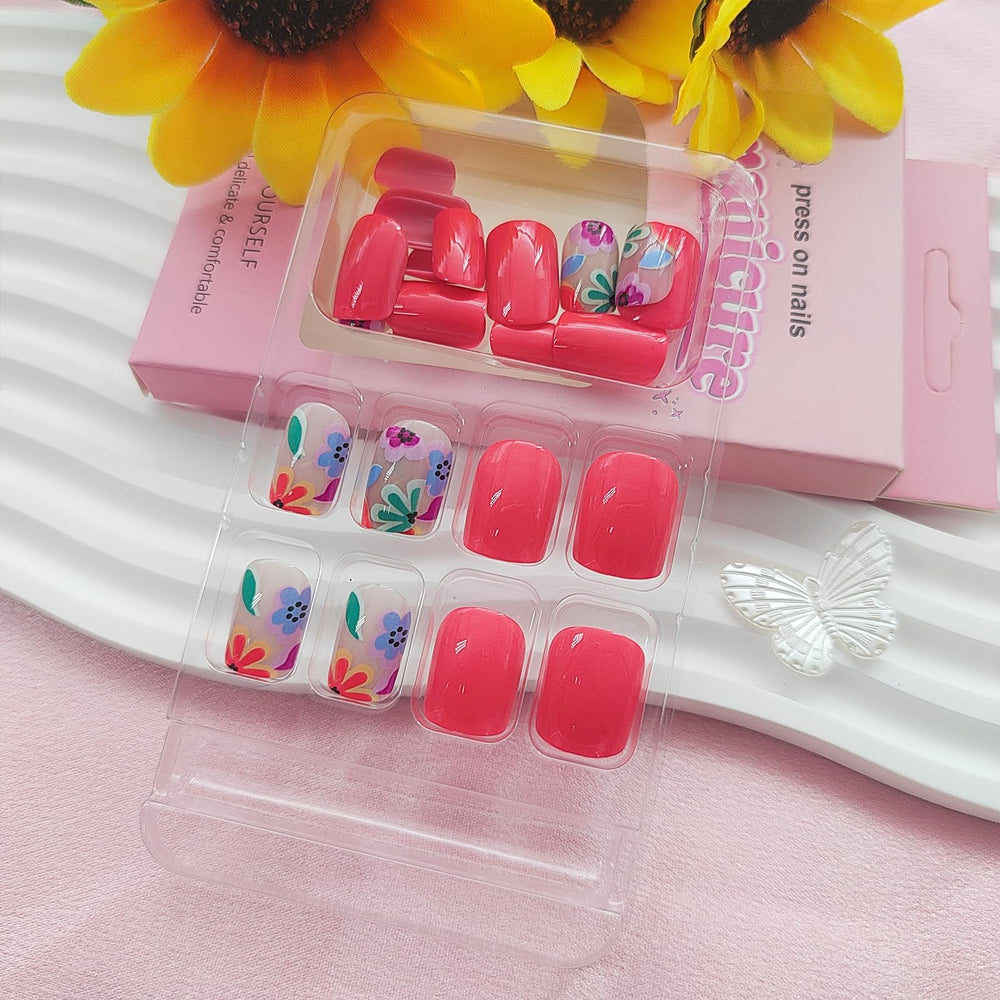 YOJIATOP close-up of orange-red floral print nails showing detailed glossy finish