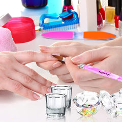 Yokilly brush painting a fine nail tip for detailed nail art